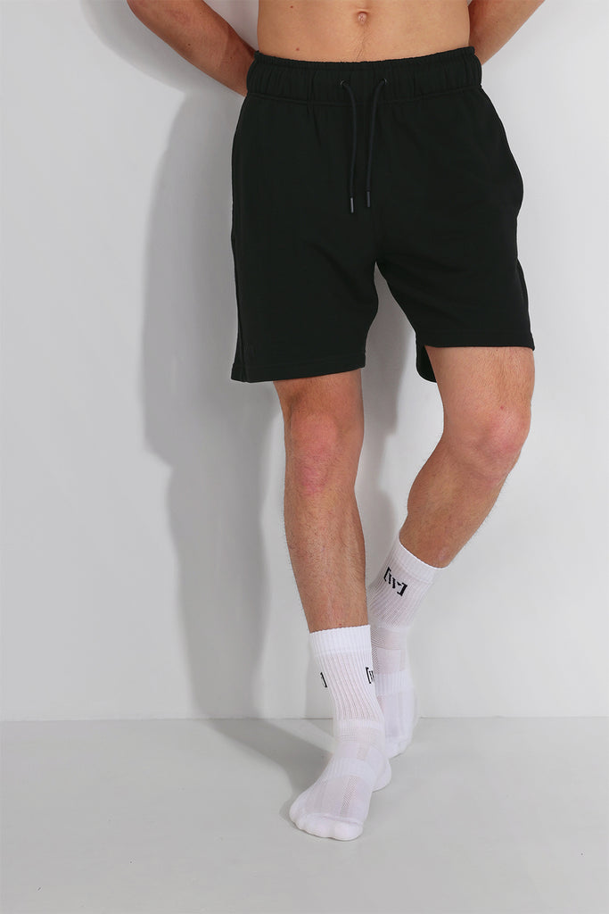 A pair of black bamboo shorts, made from a blend of sustainable bamboo and cotton fabrics